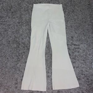 It’s crème white Aries bell bottom cotton with stripped texture